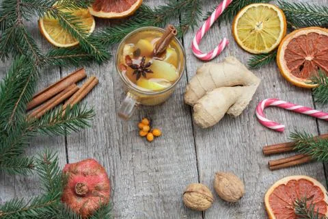 Christmas composition. Spruce branches, candy cane, warming tea Stock-Fotos