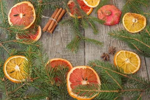 Christmas composition. Spruce branches, candy cane, warming tea Stock Photos