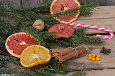 Christmas composition. Spruce branches, candy cane, warming tea Stock Photos