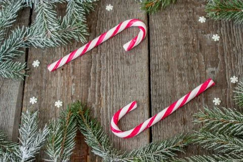 Christmas composition. Spruce branches, candy cane. Hot cocoa with smoke Stock Photos