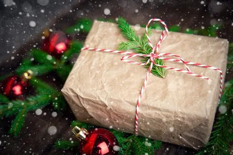 Christmas Composition Top View. gift box in craft paper Fir Tree Toys with Ba Stock Photos