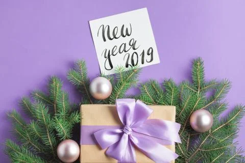 Christmas composition tree branches craft gift balls lettering Stock Photos