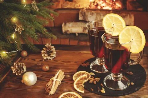 Christmas composition - two glasses with mulled wine on a wooden table near a Stock Photos