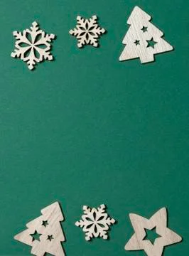 Christmas composition vertical. Border made of wooden Xmas decorations up and Stock Photos