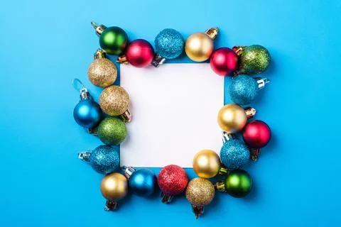 Christmas composition with white square copy space. Colorful ornaments Stock Photos