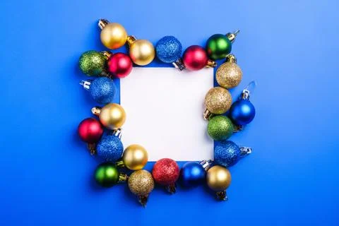 Christmas composition with white square copy space. Colorful ornaments Stock Photos