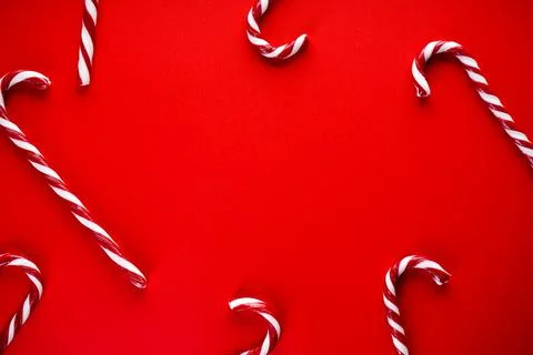 Christmas concept. Christmas candy on a red background. Traditional christmas Stock Photos