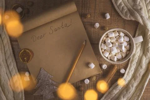 Christmas concept with cup of coffee with marshmallows and notepad Stock Photos