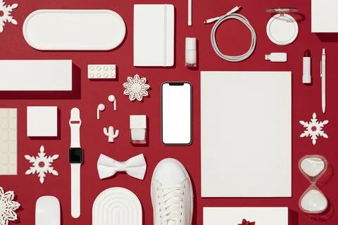 Christmas concept flat lay on red background with white objects Stock Photos