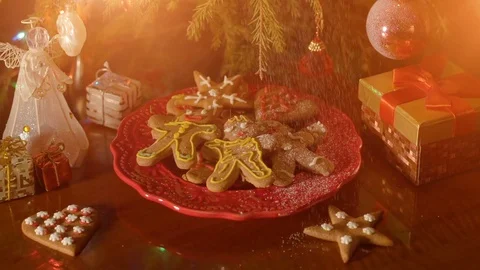 Christmas concept with gingerbread man cookie on red plate Stock Footage 71578523