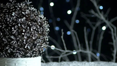 Christmas cone topiary on a dark background with snow and  flickering lights Stock Footage 119223432