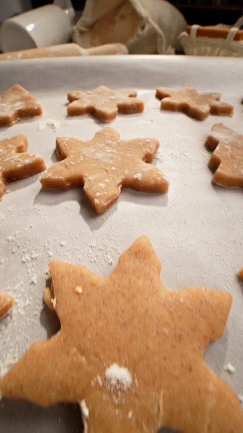 Christmas cookie dough and baking tools on parchment. 動画素材 320836060