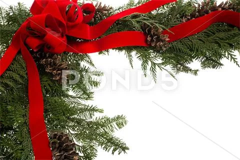 Christmas corner border with bow and cones Stock-Fotos