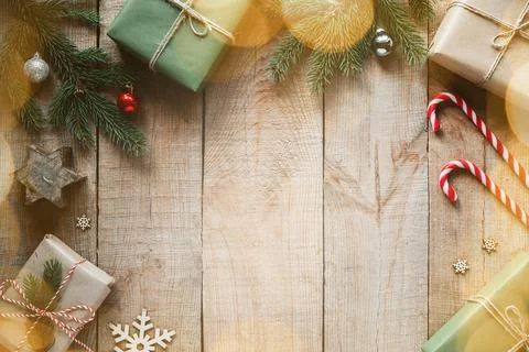 Christmas creative layout with gift boxes, candy canes, and pine tree branches Stock Photos