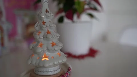 Christmas decor candlestick tree flower christmas star on table in room Stock Footage 293474716