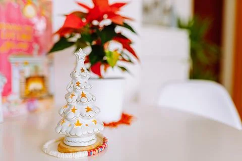Christmas decor candlestick tree flower christmas star on table in room Stock Photos