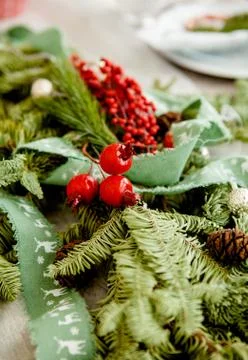 Christmas decor elements in the form of berries on a fir branch Foto stock