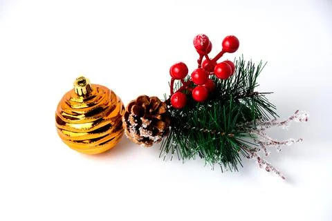Christmas decor pine branch, pine cone and yellow ball on white background Fotos Stock