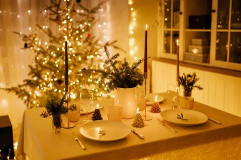 Christmas decor in the setting of a festive table for lunch or dinner. Stock Photos