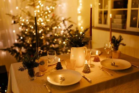 Christmas decor in the setting of a festive table for lunch or dinner. Stock Photos