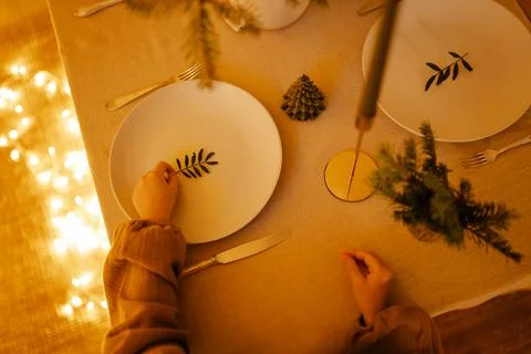 Christmas decor in the setting of a festive table for lunch or dinner. Stock Photos