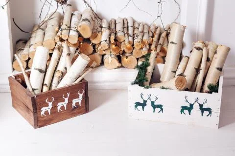 Christmas decor. Stack of firewood ready for the fireplace divided in boxes Stock Photos