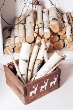Christmas decor. Stack of firewood ready for the fireplace divided in boxes Stockfoto's