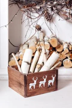 Christmas decor. Stack of firewood ready for the fireplace divided in boxes Stock Photos