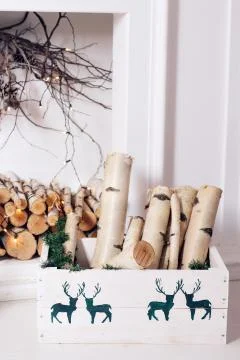 Christmas decor. Stack of firewood ready for the fireplace divided in boxes Stockfoto's