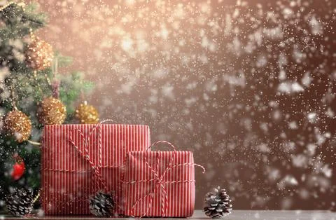 Christmas decorated tree with gift boxes in defocused snowfall. Holiday eve. Stock-Illustration