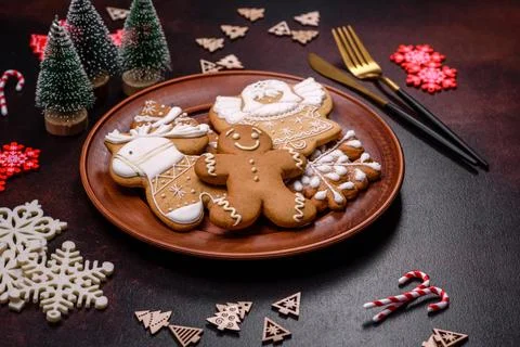Christmas decoration elements as well as gingerbread on a brown concrete ba.. Stock Photos