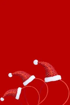 Christmas decoration in the form of a pattern with a red cap on a red backgro Stock Photos