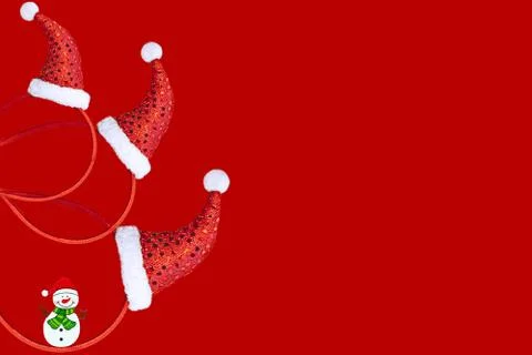 Christmas decoration in the form of a pattern with a red cap on a red backgro Stock Photos