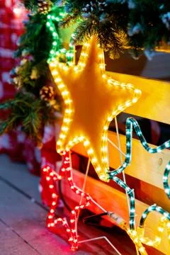 Christmas decoration glowing stars from bulbs and diodes. New Year's decor at Stock Photos