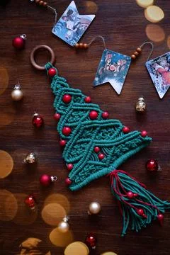 Christmas decoration macrame tree on the table top view Stock Photos
