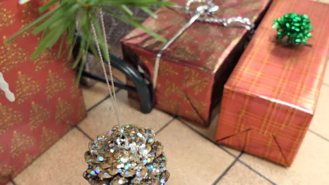 A Christmas decoration over boxes with presents. Stock Footage 98475242