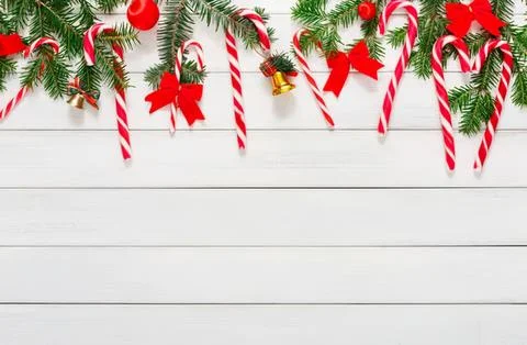 Christmas decoration with pine branches candy canes and bows Stock Photos