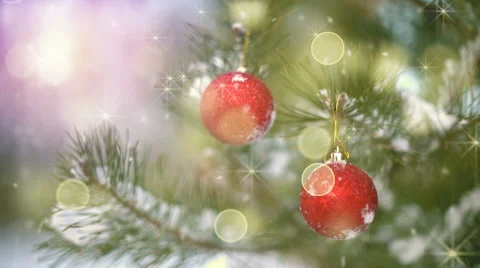 Christmas decoration on tree and fairy snowfall seamless loop Stock Footage