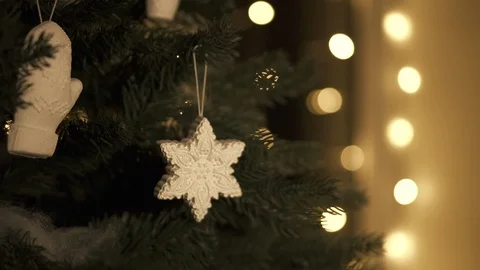Christmas Decoration on tree. Pan up down. Background warm bokeh  스톡 동영상 98952776