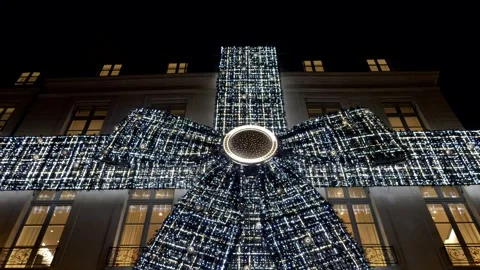 Christmas decorations on the ancient building facade in Paris. Tilt 4K Stock Footage 300180843