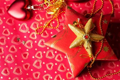 Christmas decorations and  present box at red background. Christmas holiday c Stock Photos