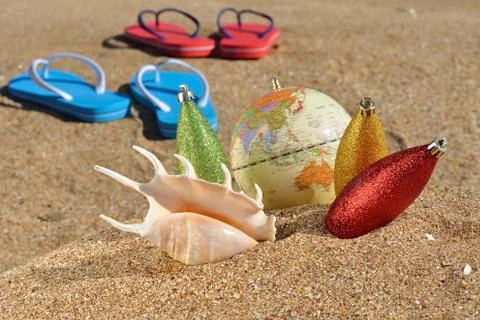 Christmas decorations and seashell Stock Photos