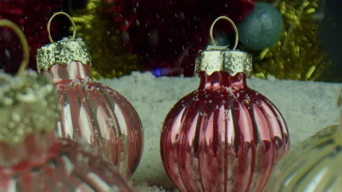 Christmas decorations are located on a layer of artificial snow. Glass balls are Stock Footage 165949077
