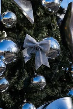 Christmas decorations on the branches of the tree. A bow on the Christmas tre Stock Photos