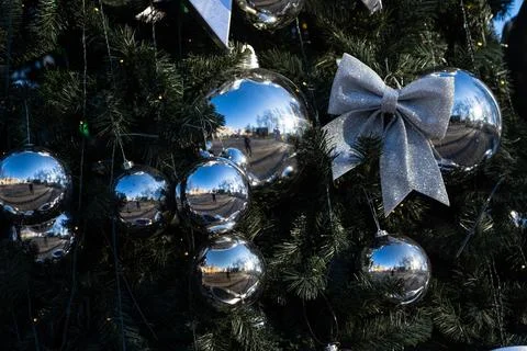 Christmas decorations on the branches of the tree. A bow on the Christmas tre Stock Photos