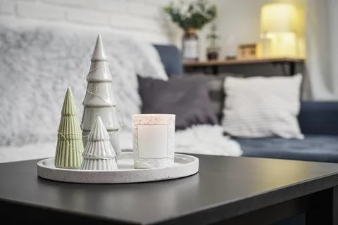 Christmas decorations with candle on coffee table Stock Photos