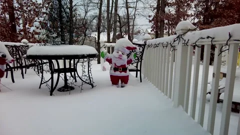 Christmas Decorations covered in snow Stock Footage 145320286