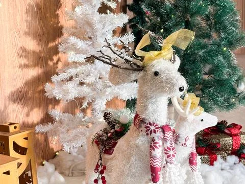 Christmas decorations featuring two plush white reindeer figurines Stock Photos