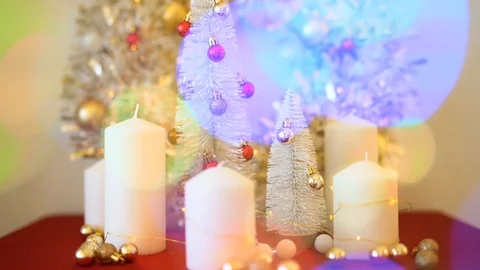 Christmas decorations in gold colour on red table Stock Footage