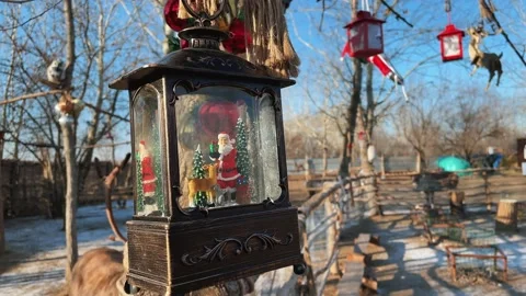 Christmas decorations hang on the branches of trees. Christmas festive Stock Footage 227920682